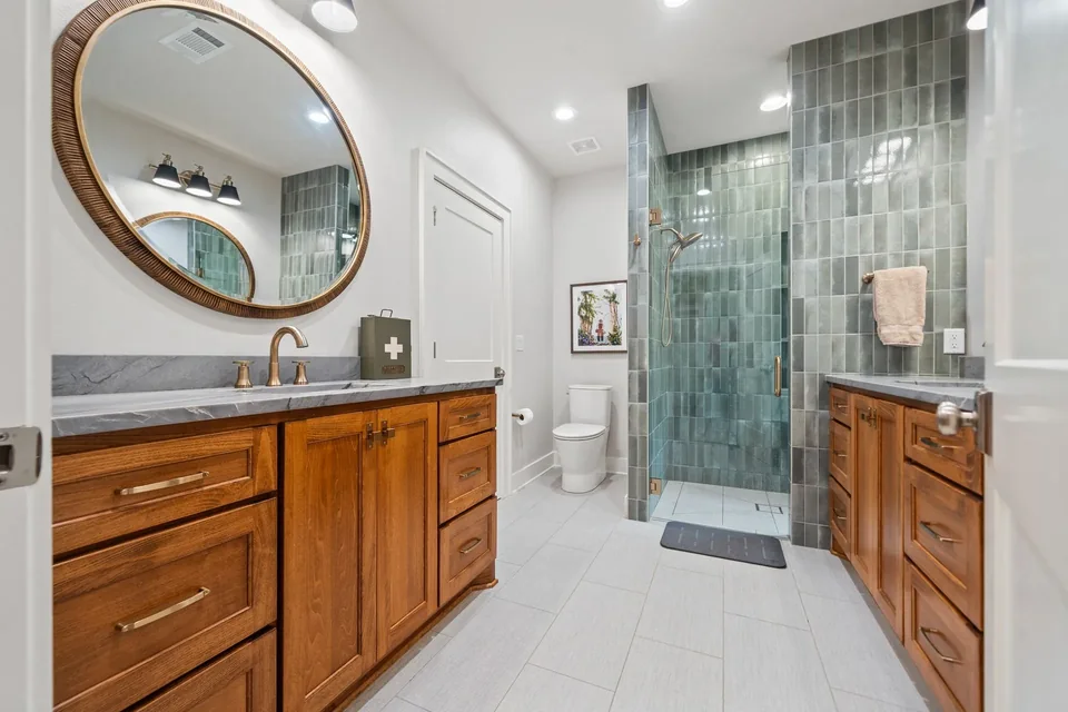 Chinqopin Drive: Completed bathroom: shower tile, floor tile, and finish hardware